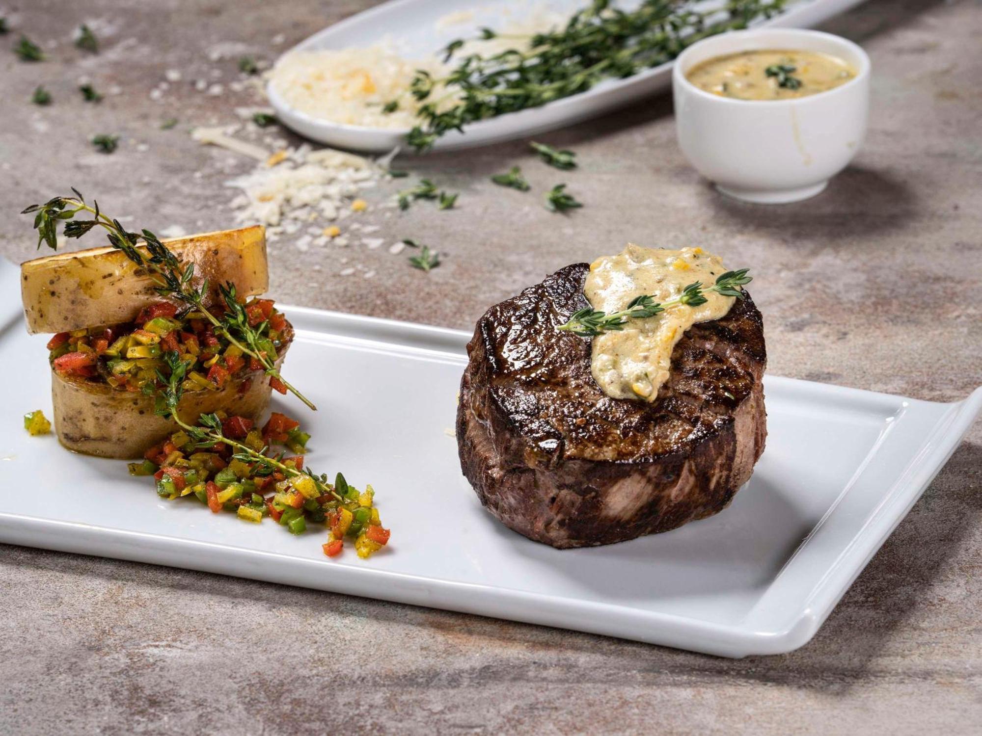Mövenpick Hotel And Residences Riyadh Exteriör bild A steak prepared with a butter sauce